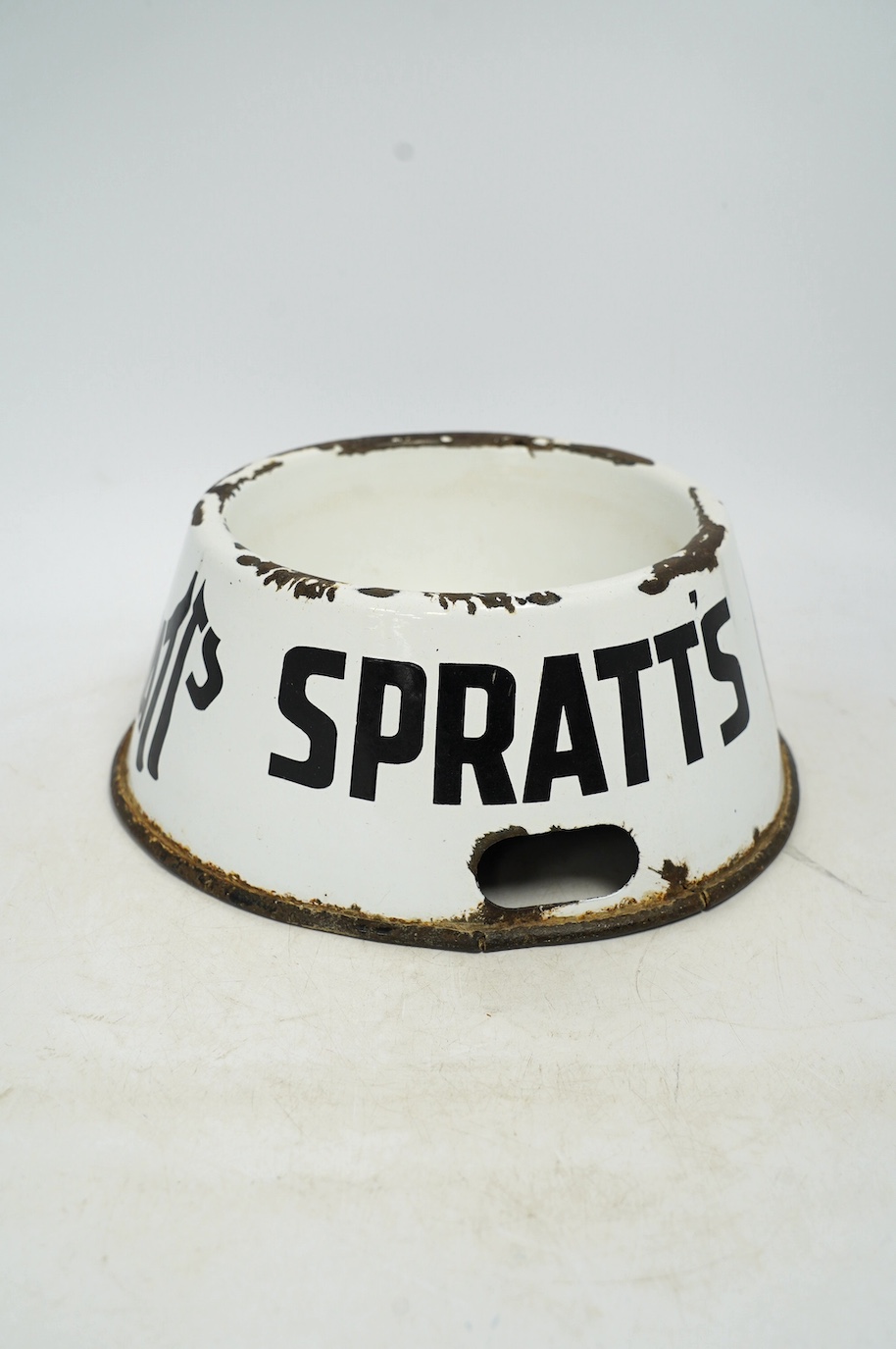 A vintage Spratt’s circular enamel advertising dog bowl, 27cm diameter, 10cm high. Condition - poor